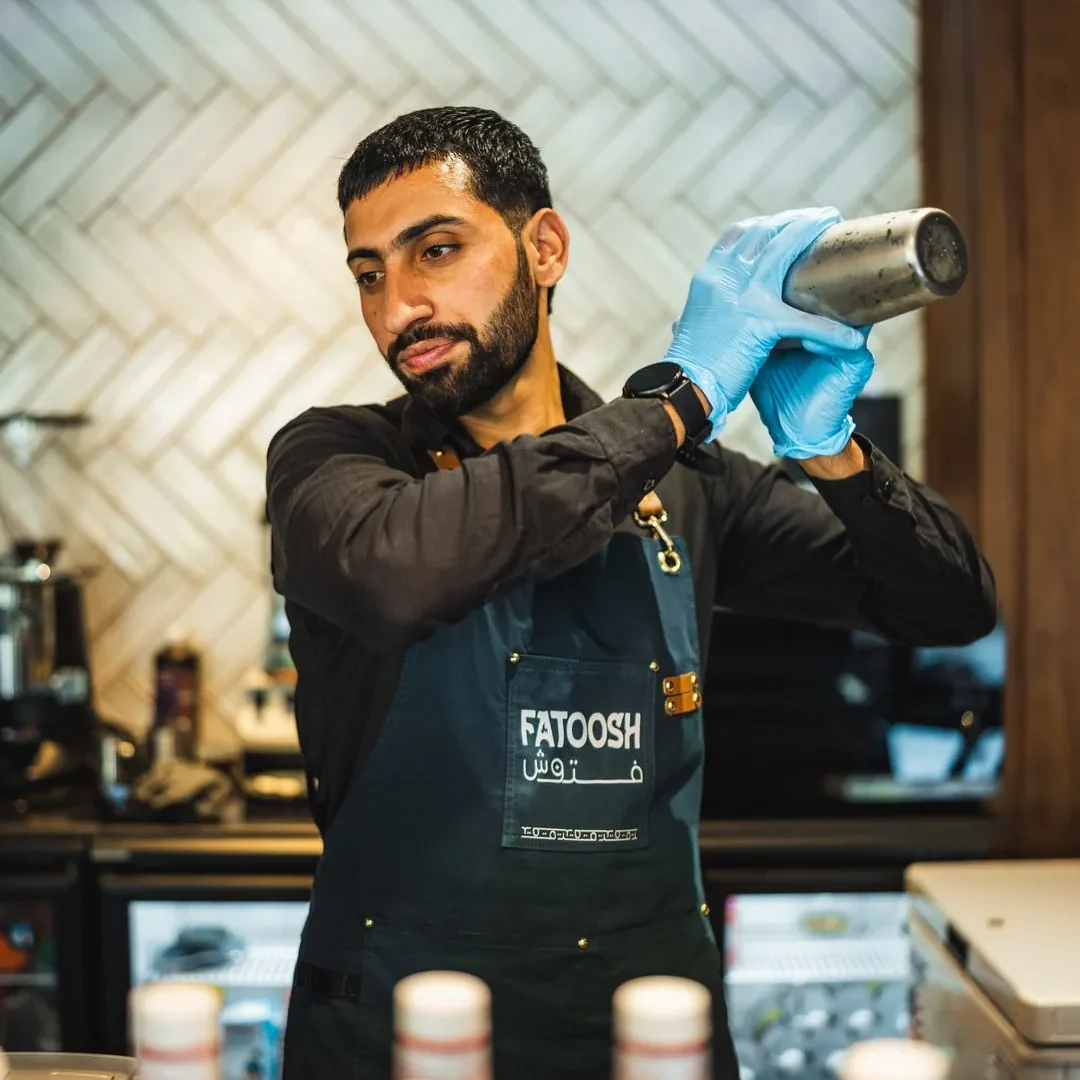 Fatoosh bartender shaking a drink at the bar