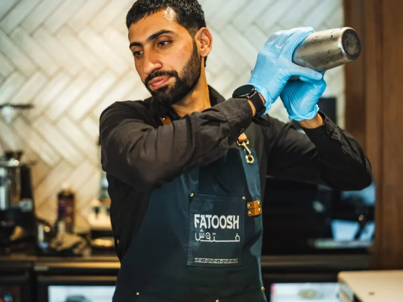 Fatoosh bartender shaking a drink at the bar