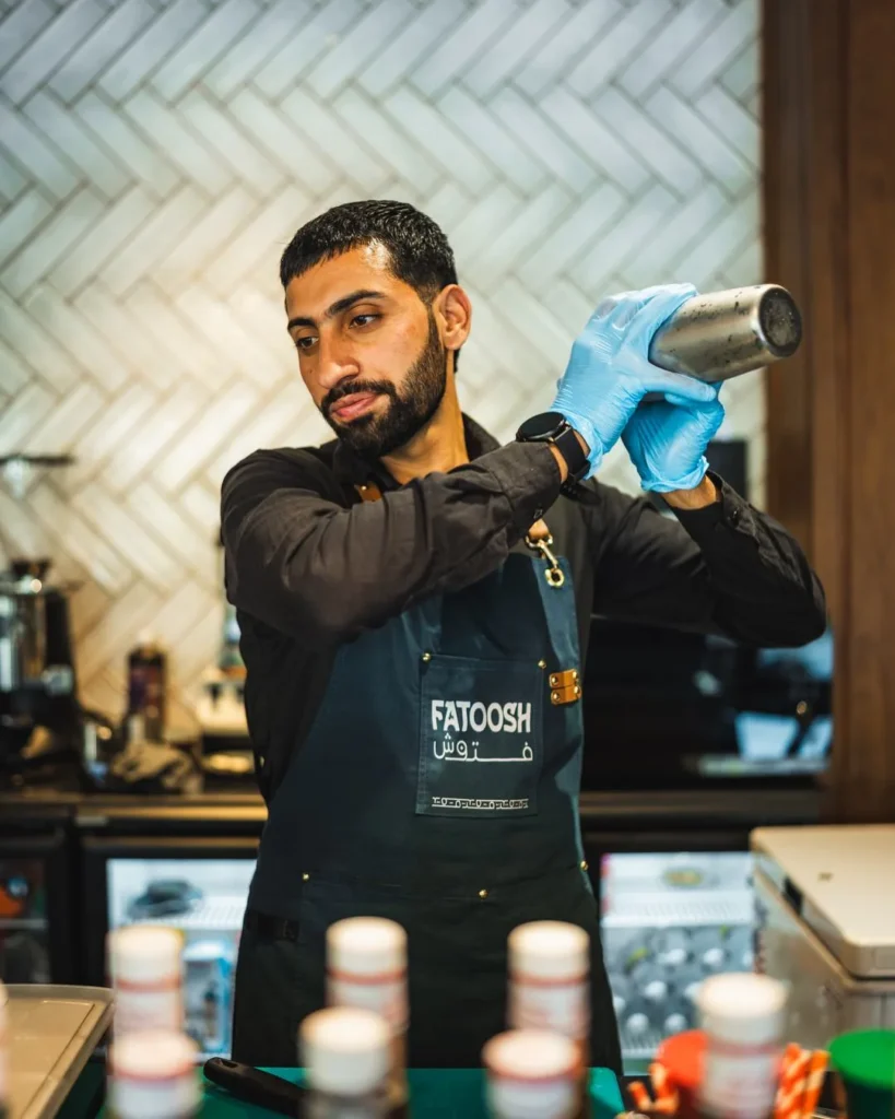 Fatoosh bartender shaking a drink at the bar