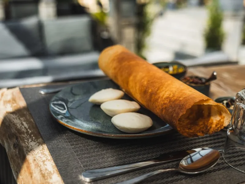 Masala dosa served with idli and chutneys
