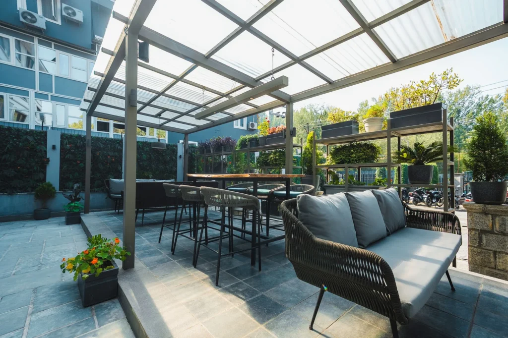 Lounge seating and high tables under the terrace roof