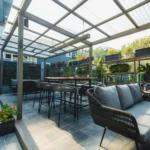 Lounge seating and high tables under the terrace roof