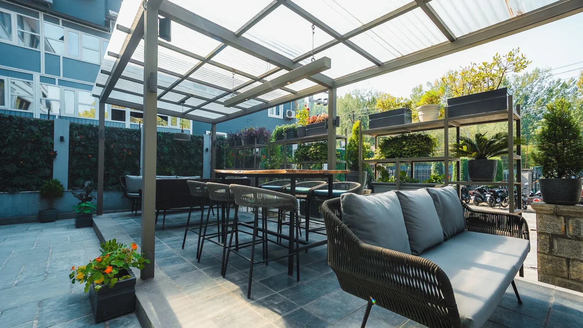 Lounge seating and high tables under the terrace roof