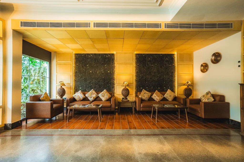 Lobby lounge with leather sofas and carved wall panels
