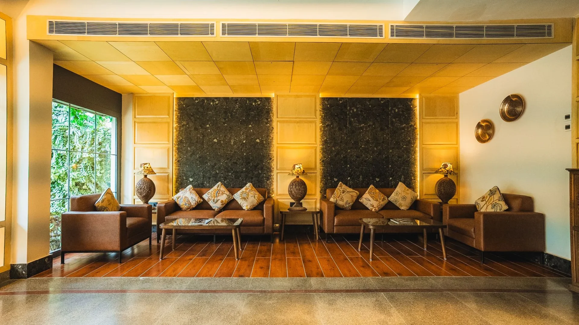 Lobby lounge with leather sofas and carved wall panels