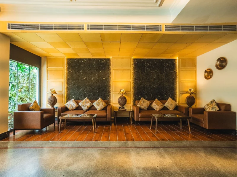 Lobby lounge with leather sofas and carved wall panels