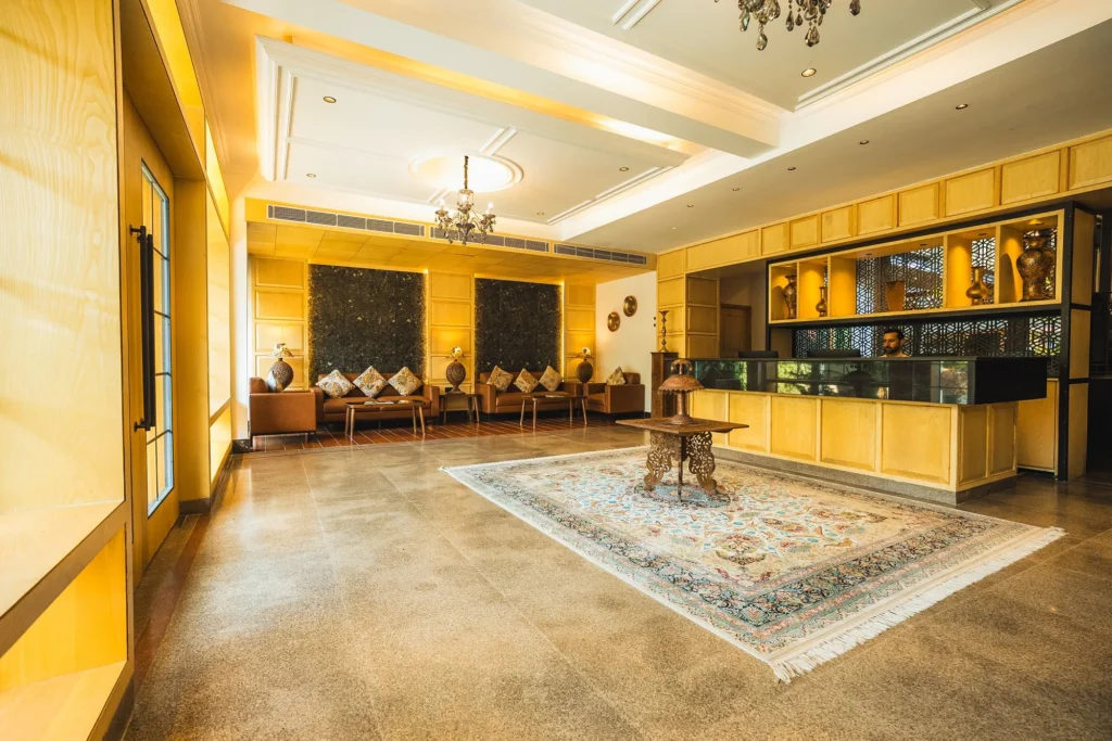 Reception lobby with a rug and seating at Wisaal Srinagar