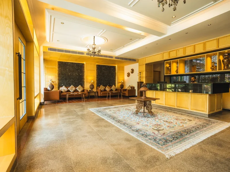 Reception lobby with a rug and seating at Wisaal Srinagar