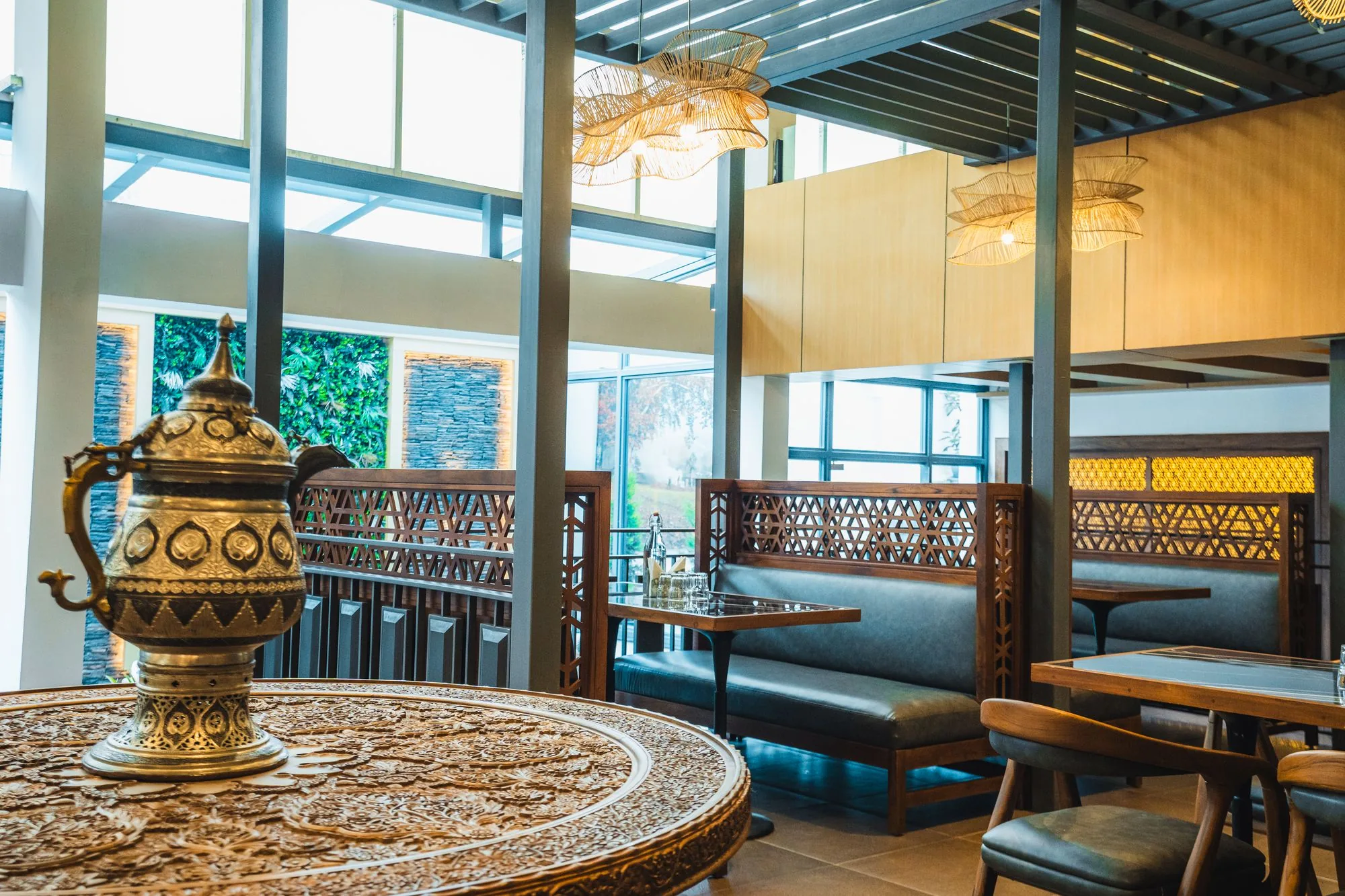 Brass samovar on a carved table in the Nayaab lounge
