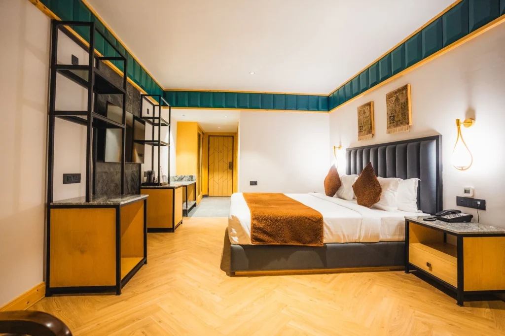 Premium Room with king bed, television unit and wooden floor