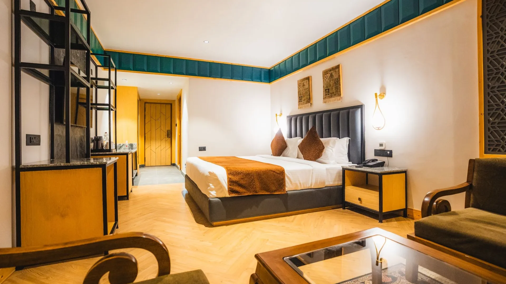 Premium Room with bed, armchair and coffee table