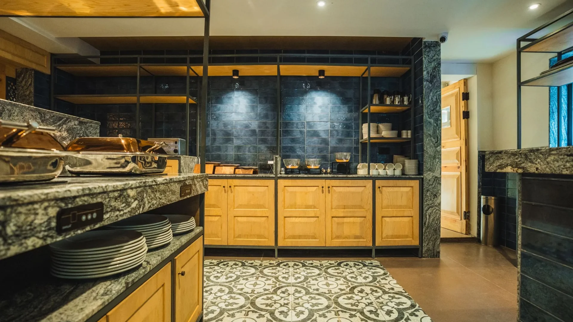 Buffet counter at the restaurant with plates and wooden cabinets